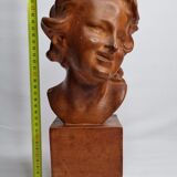Bust of a laughing child in patinated plaster, 35 cm
