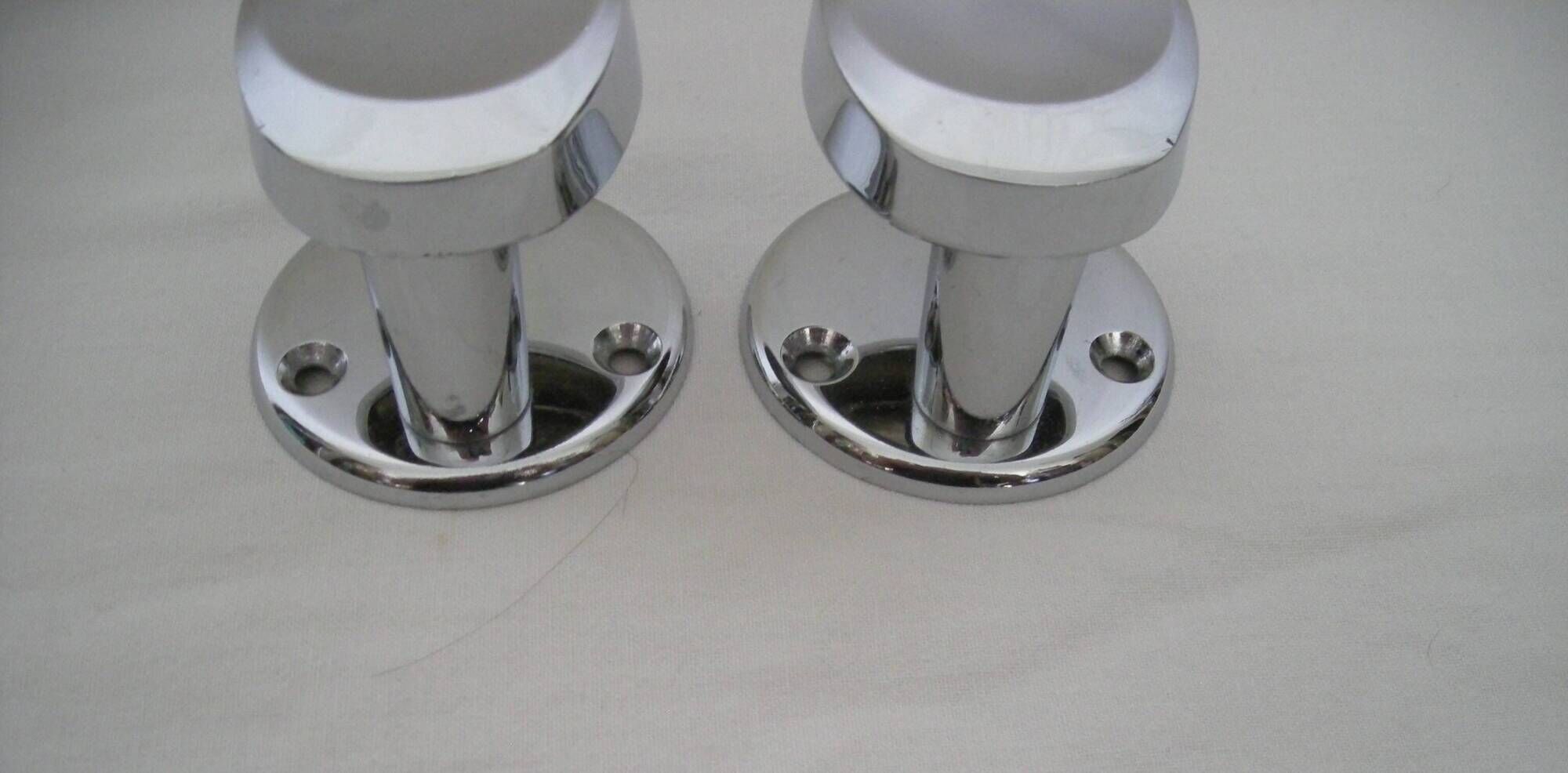 Pair of stainless steel coat racks from the 1970s.