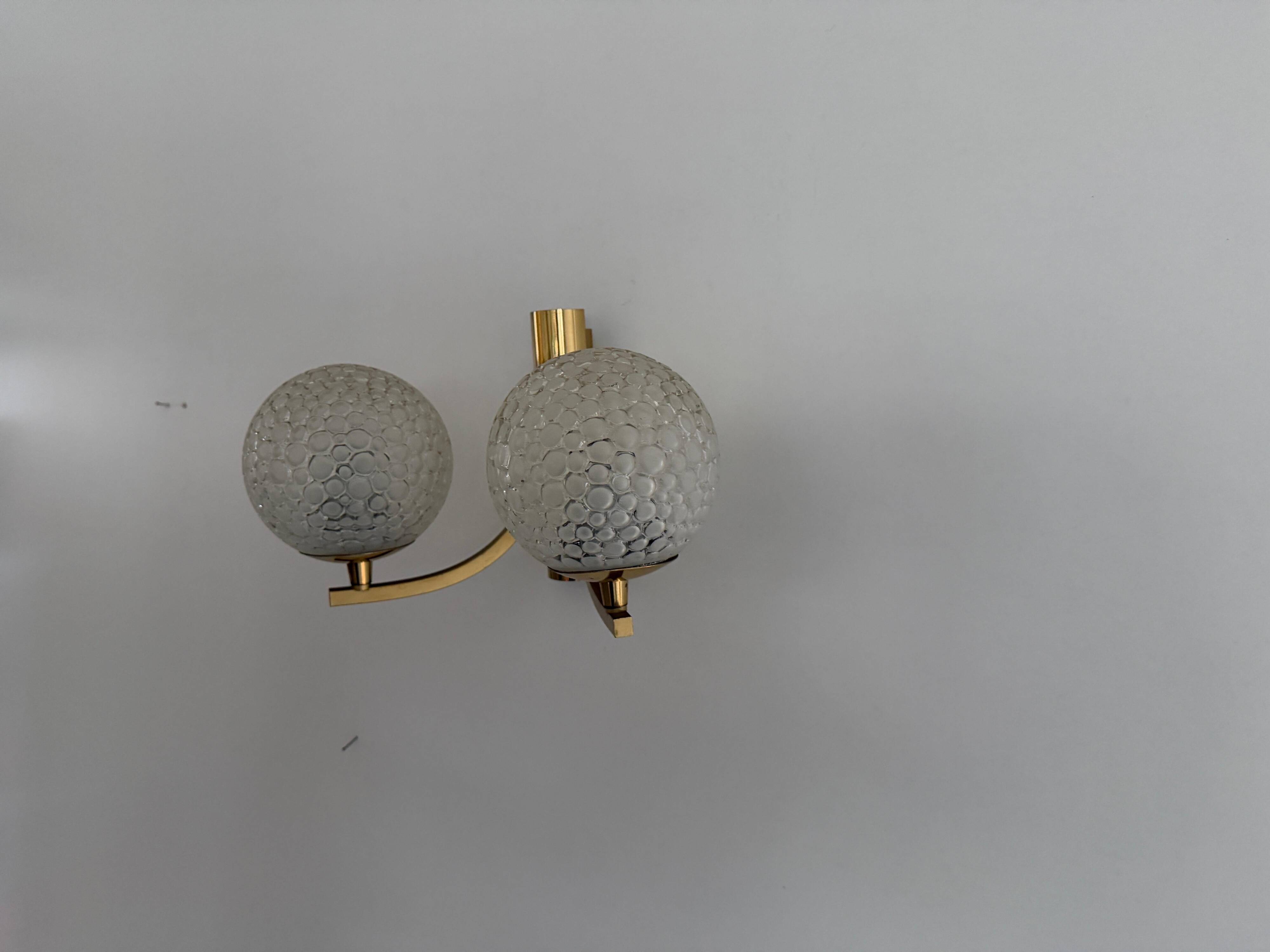 Simple two-armed wall light in brass and glass by Ball and Ball, Kaiser, 1960s, Germany.