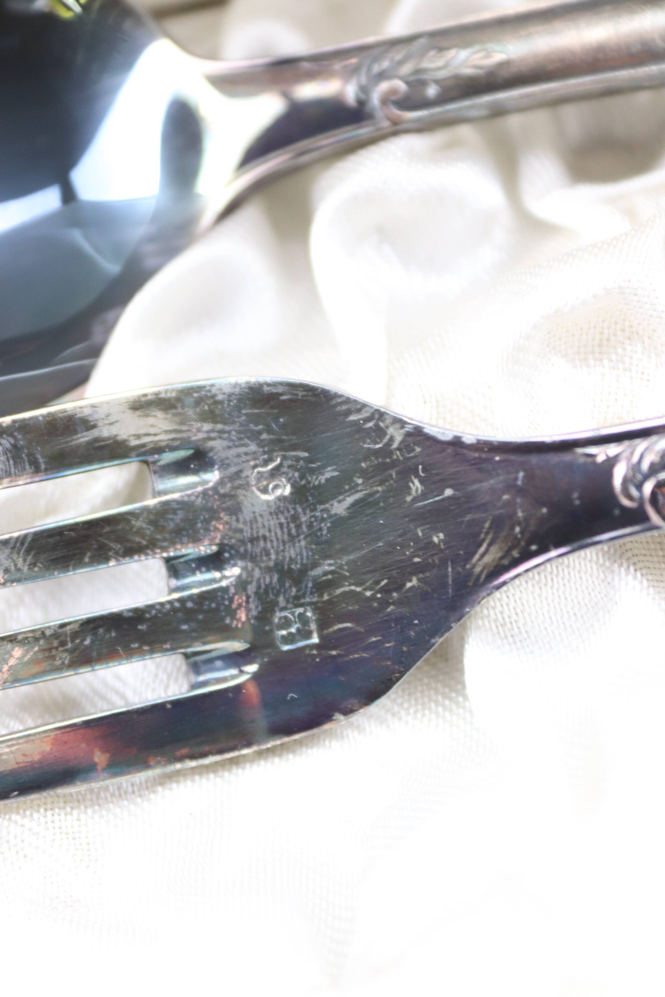 Old covered box in silver or silver metal spoon and fork with hallmarks