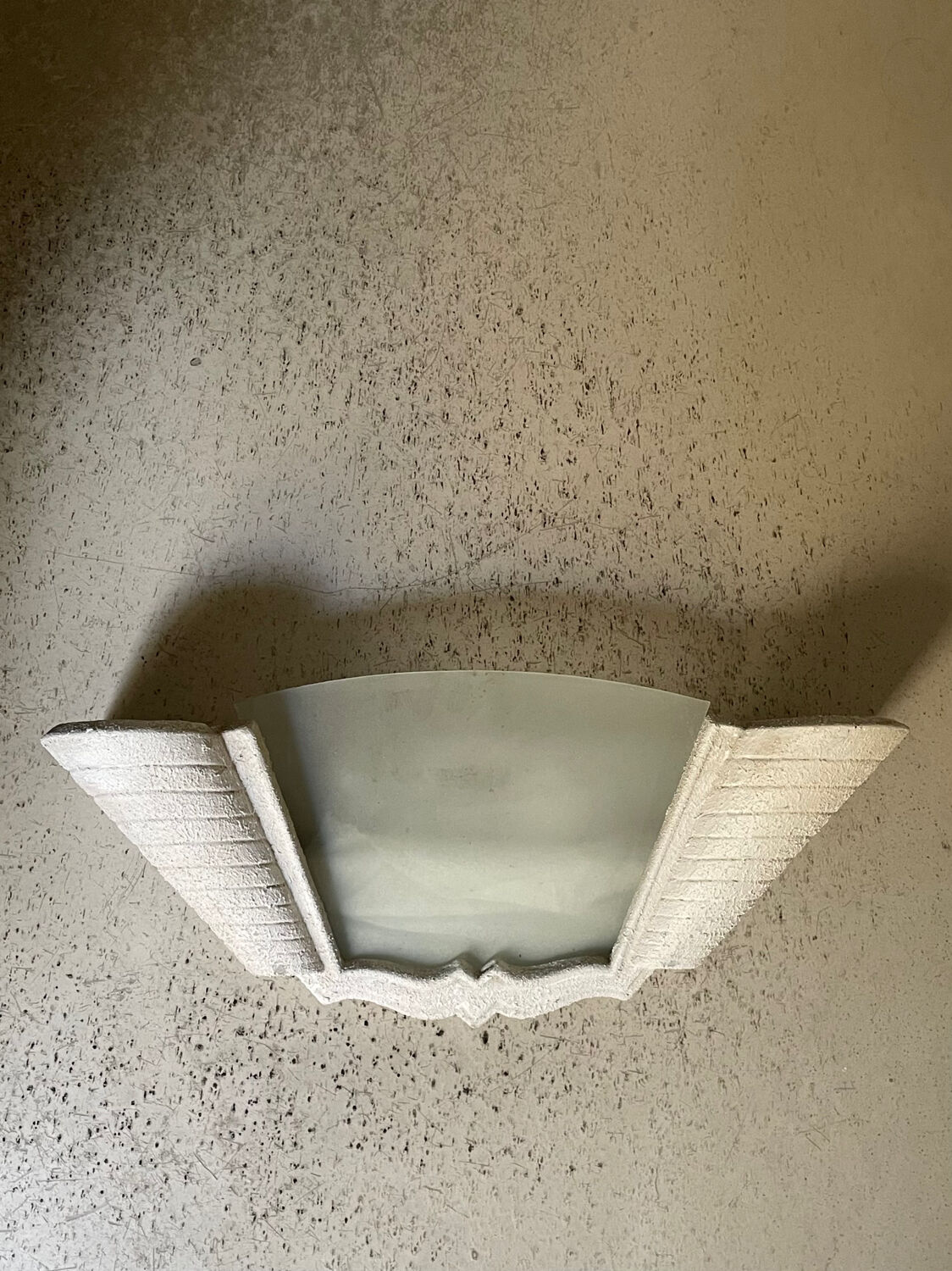 "Arlus" wall light in Art Deco style made of plaster and smoked glass.