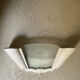"Arlus" wall light in Art Deco style made of plaster and smoked glass.