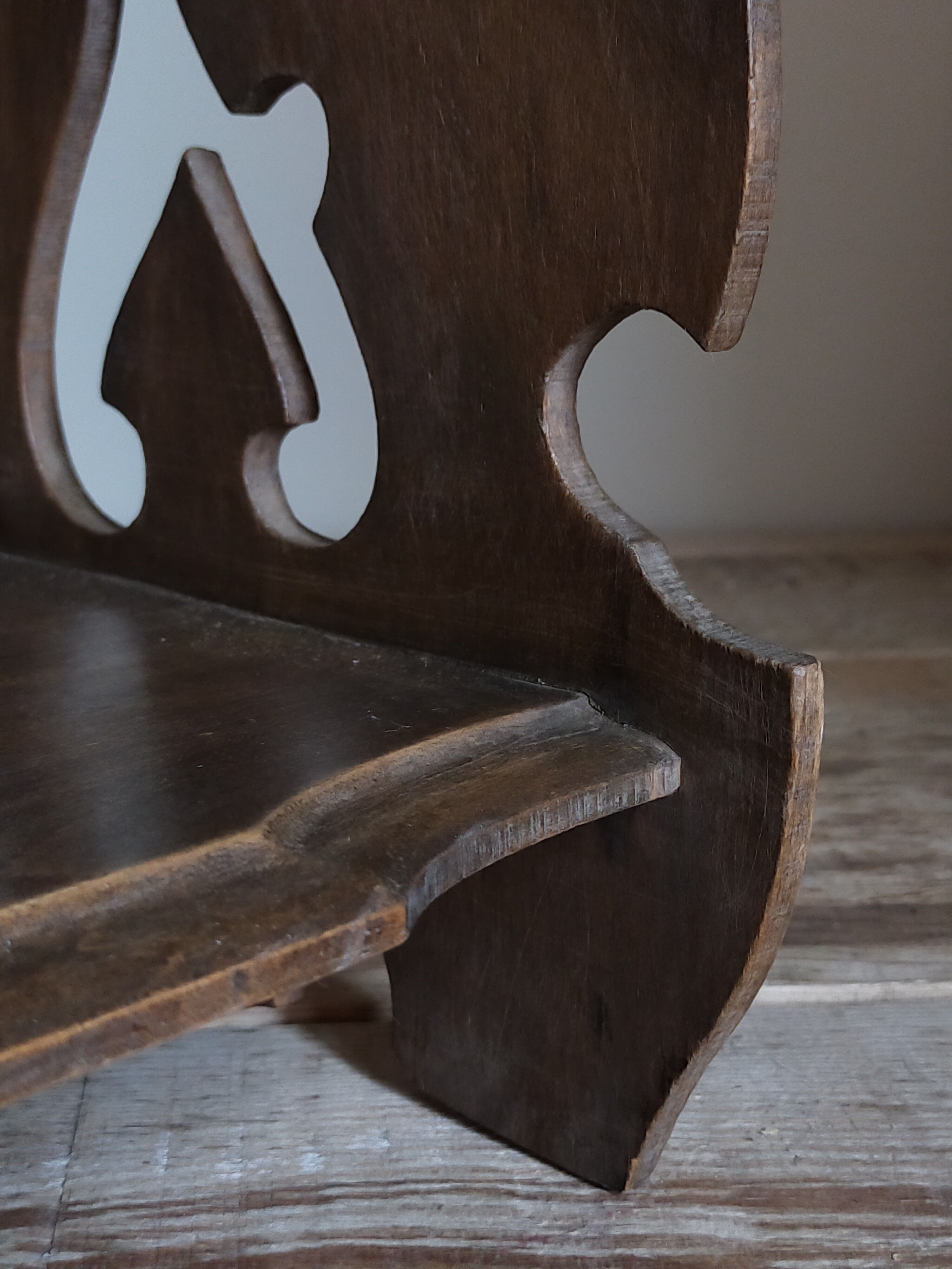 Old carved wooden wall shelf