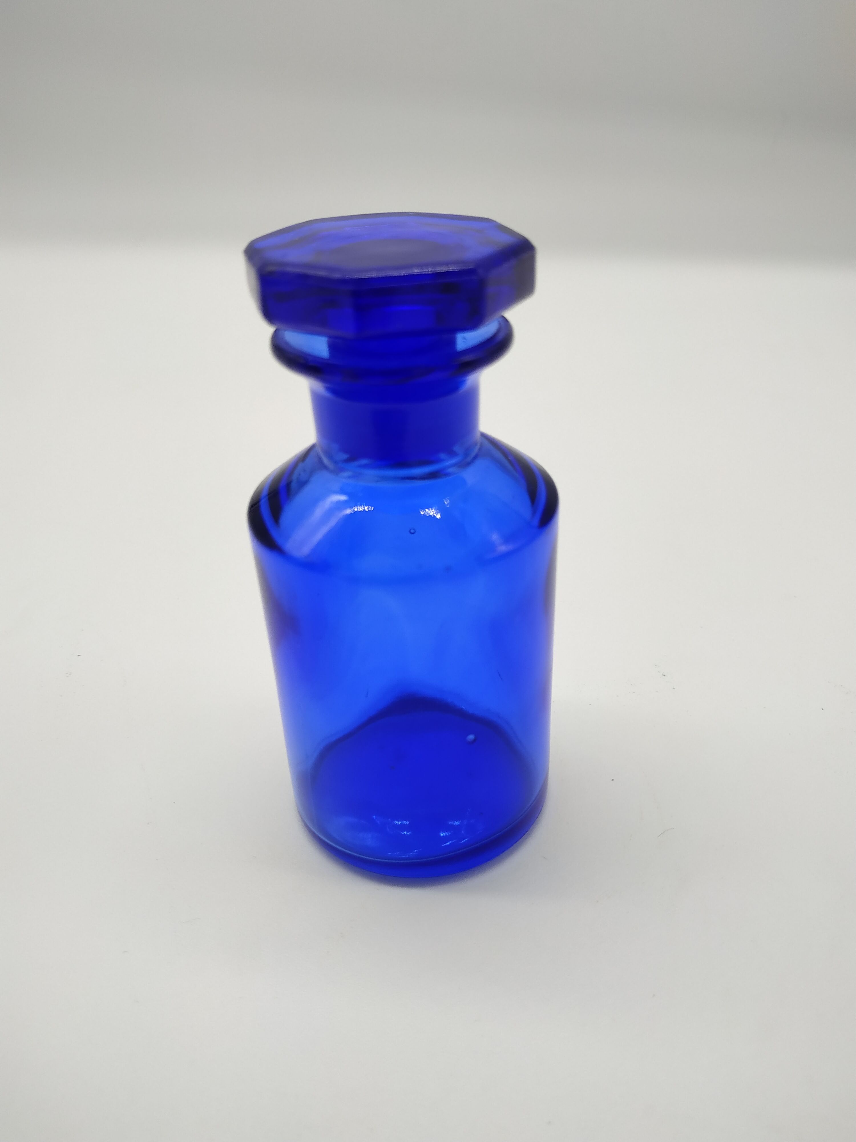 Old perfume bottle in cobalt blue glass