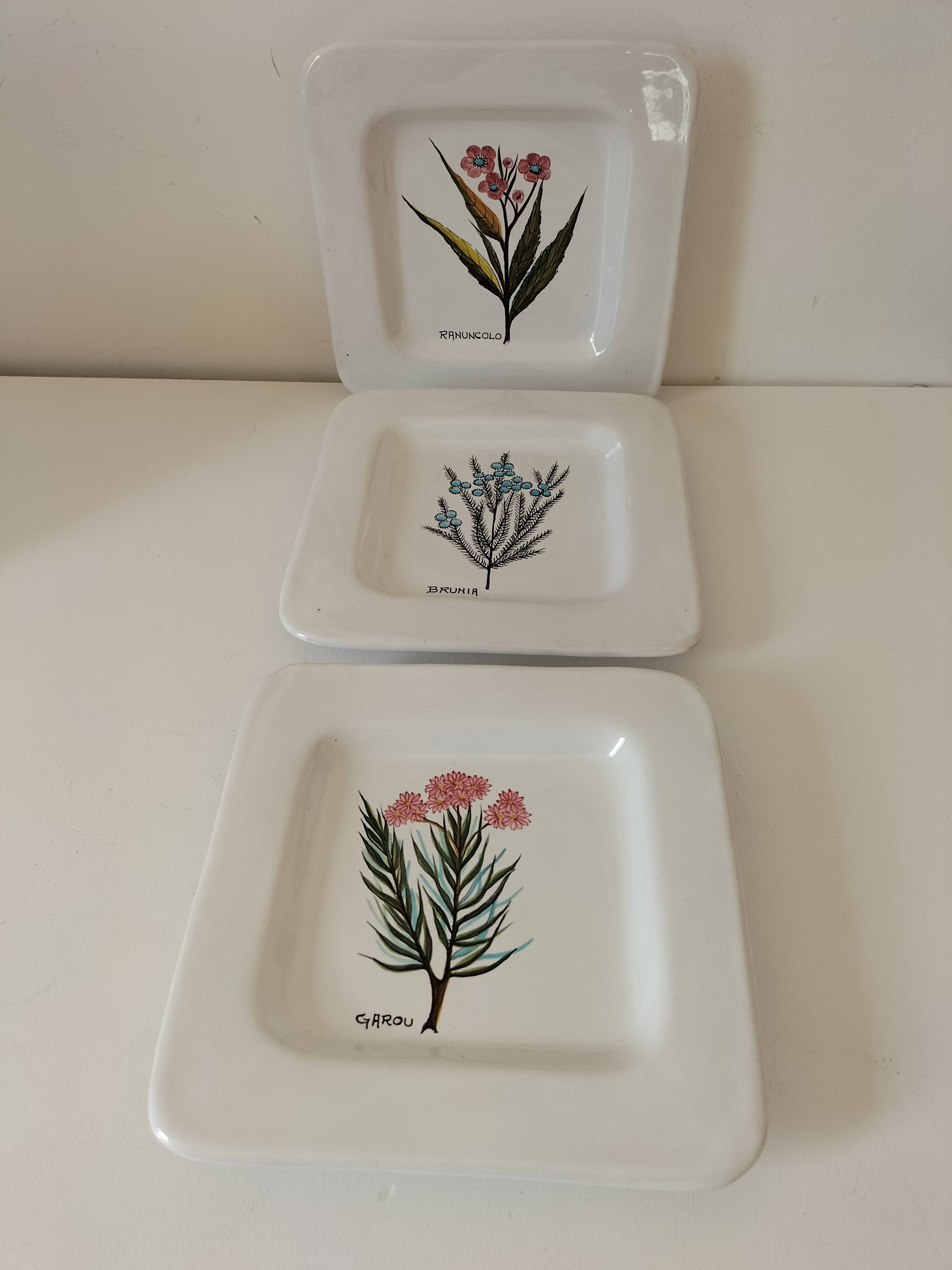 Trio of square Deruta plates signed MARI E.C., botanical decoration 962.21