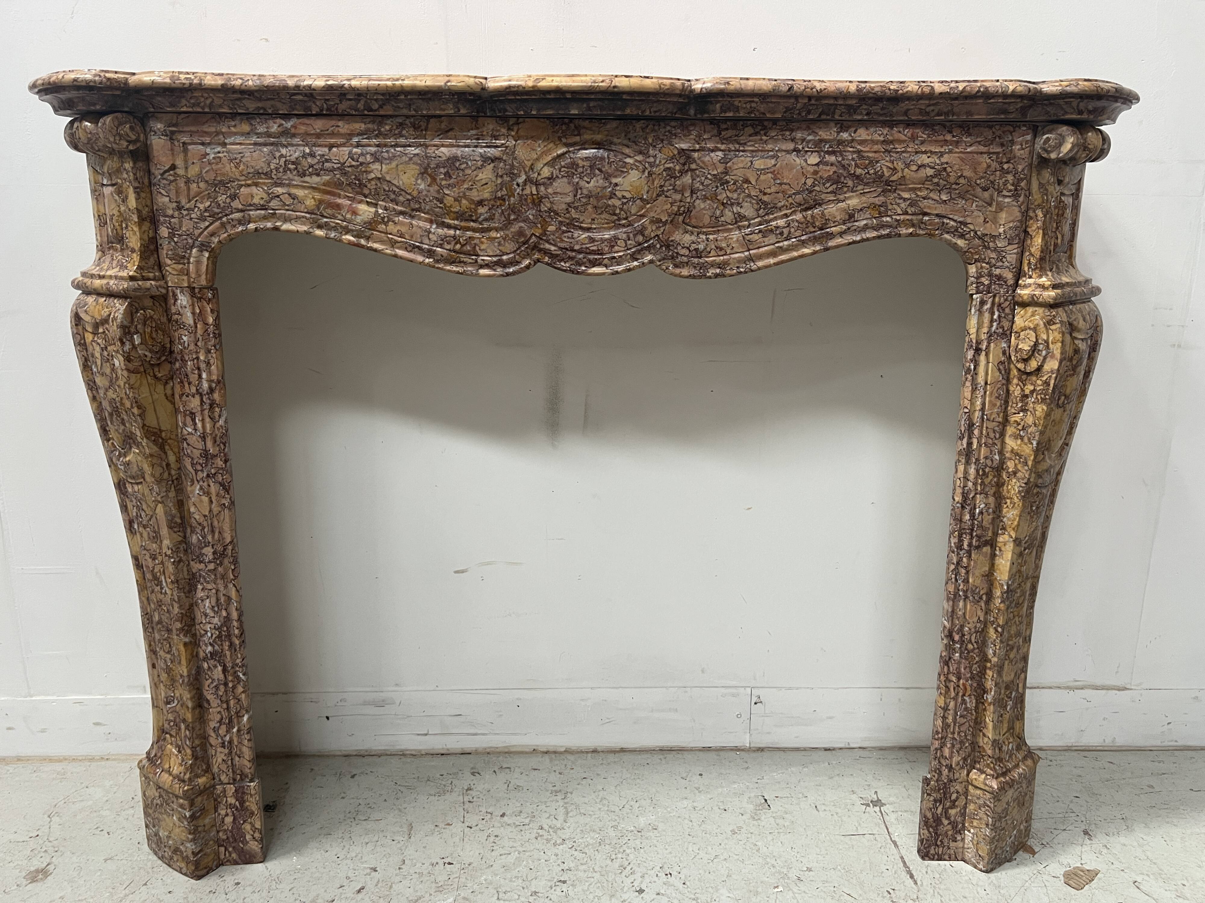 Louis XV style fireplace, Pompadour model, speckled breccia marble, 19th century