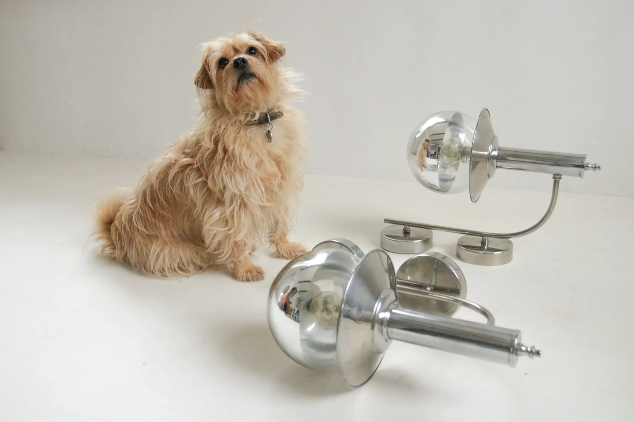 Pair of European mid-century chrome wall sconces with mirrored globe shades
