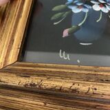 Golden frame with painting bouquet of flowers