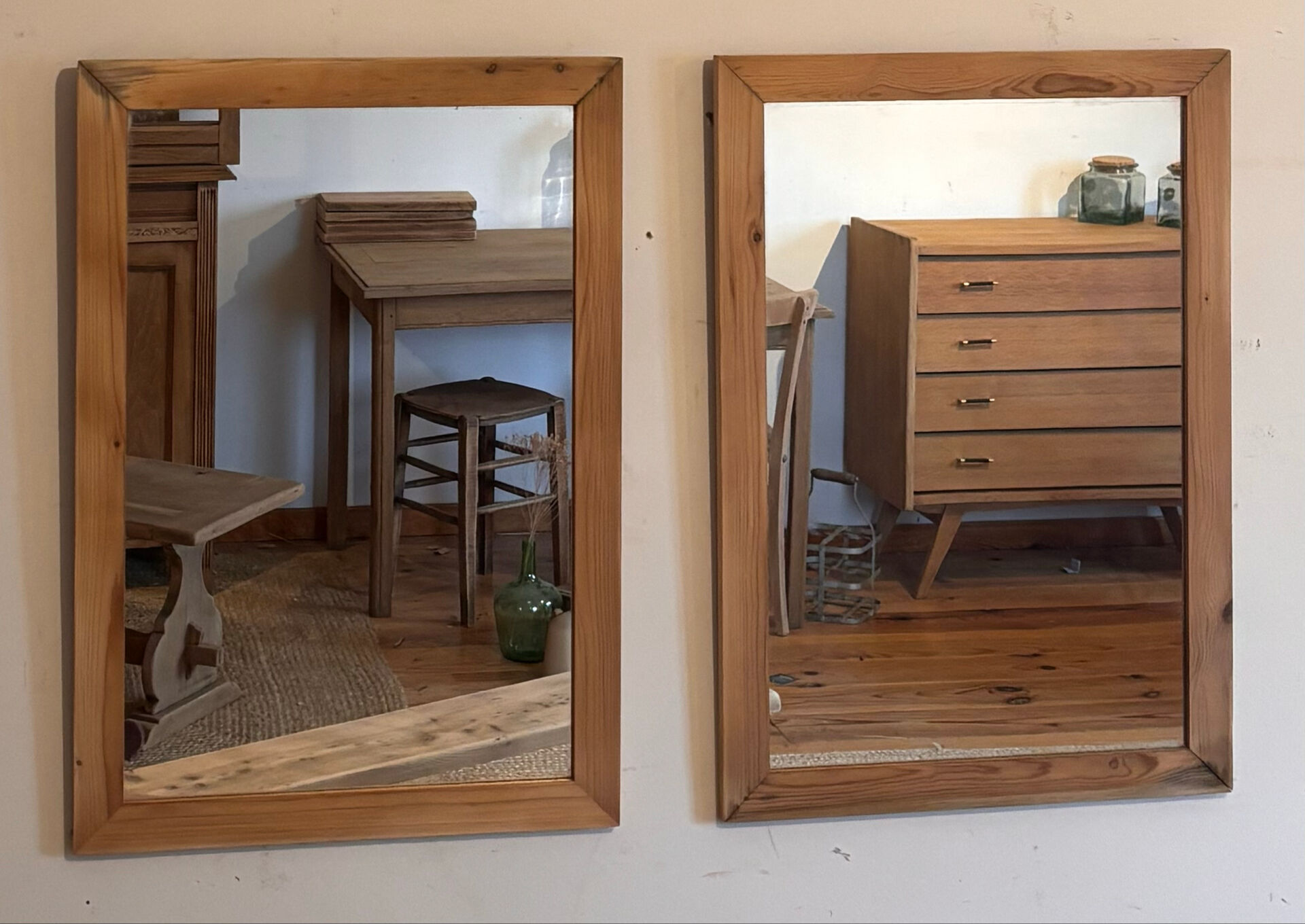 Pair of vintage antique mirrors in raw solid wood.