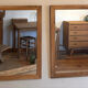 Pair of vintage antique mirrors in raw solid wood.