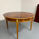 Round walnut Napoleon III extendable table with bronze top in good condition.