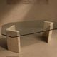 Dining table in travertine and smoked glass.