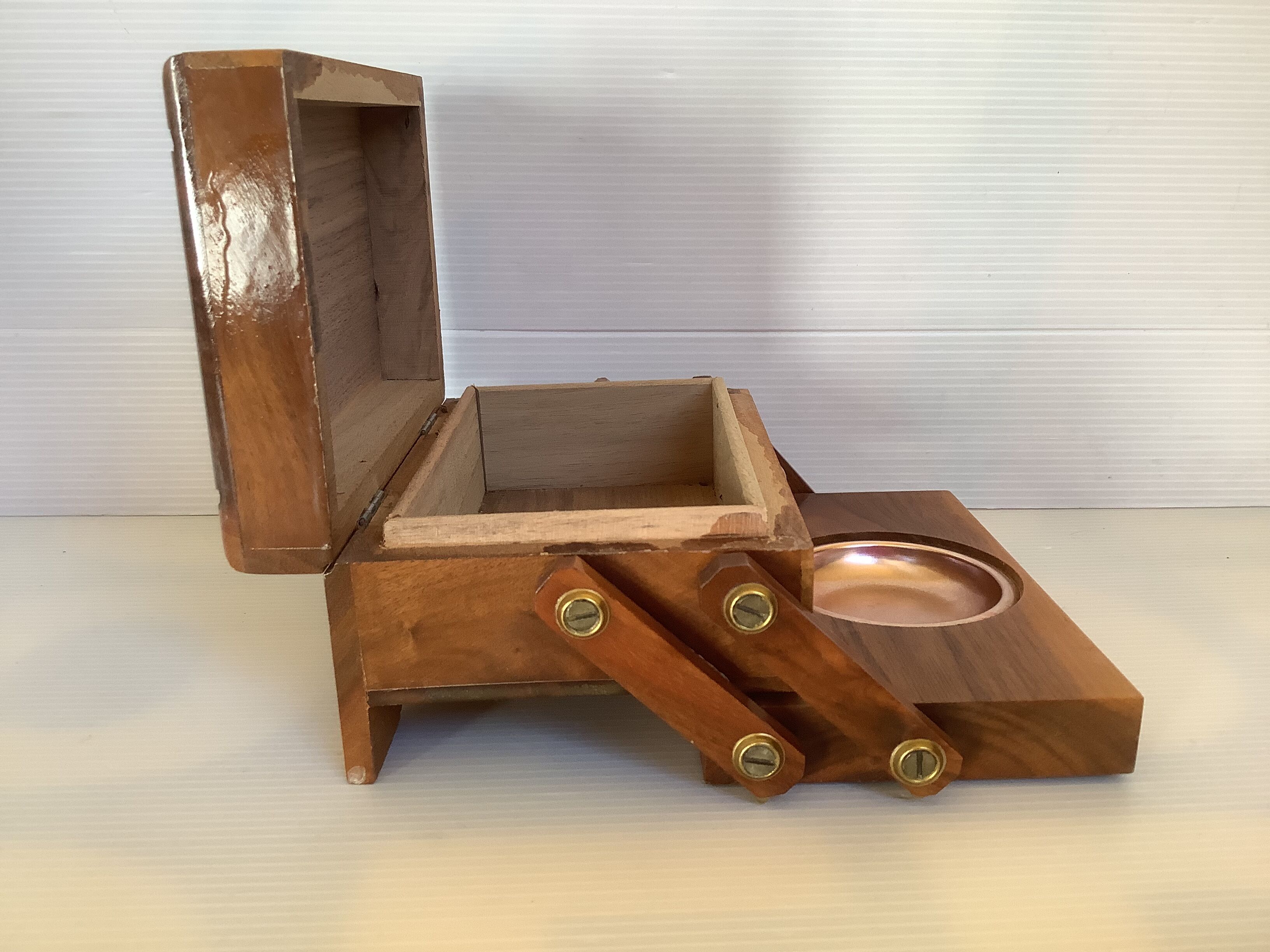 Old wooden cigarette box and ashtray