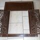 Pair of cast iron door grilles with its coat