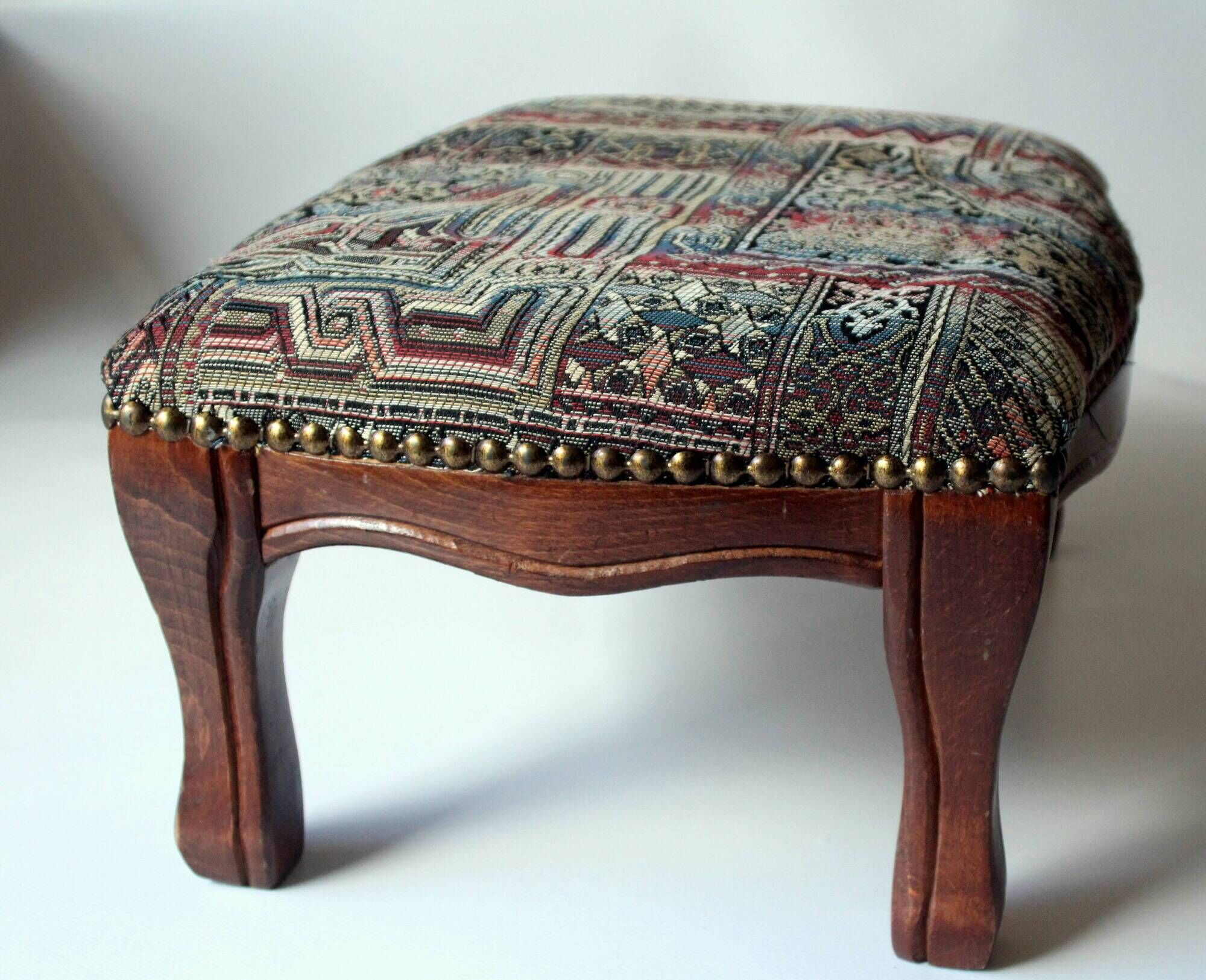 Small foot stool made of wood with upholstery, vintage from the 70s