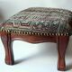 Small foot stool made of wood with upholstery, vintage from the 70s