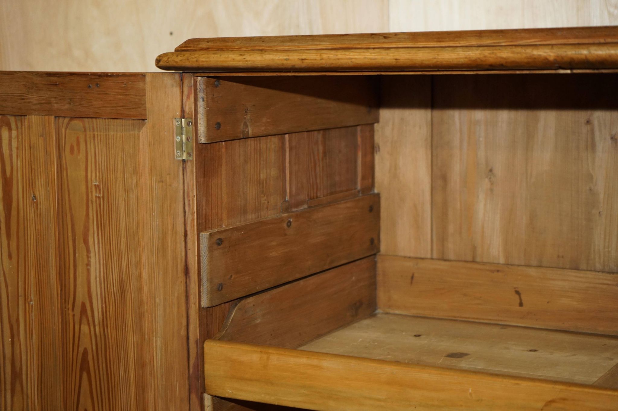 Antique Victorian pine governess buffet with sliding shelf.