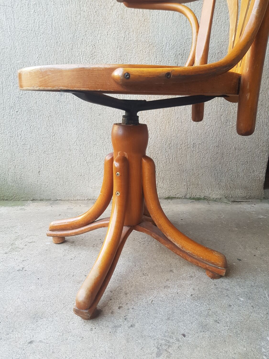 Swivel wooden armchair