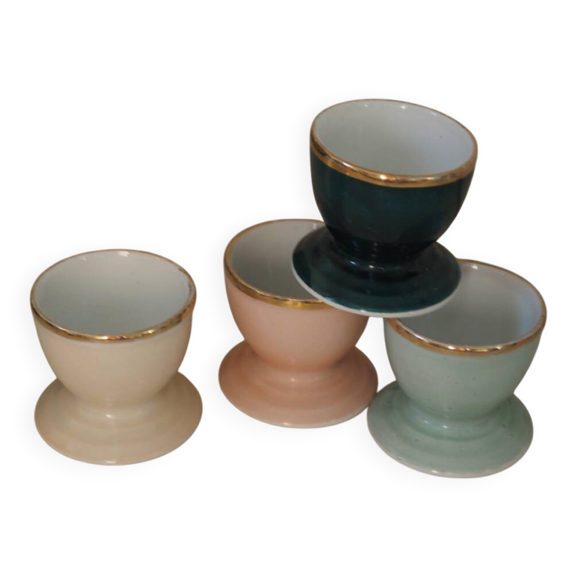 Four coloured egg cups with a golden rim from the 50s.