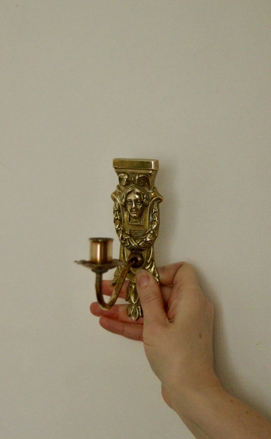 Pair of mid-century Swedish brass face motif sconces
