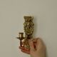 Pair of mid-century Swedish brass face motif sconces