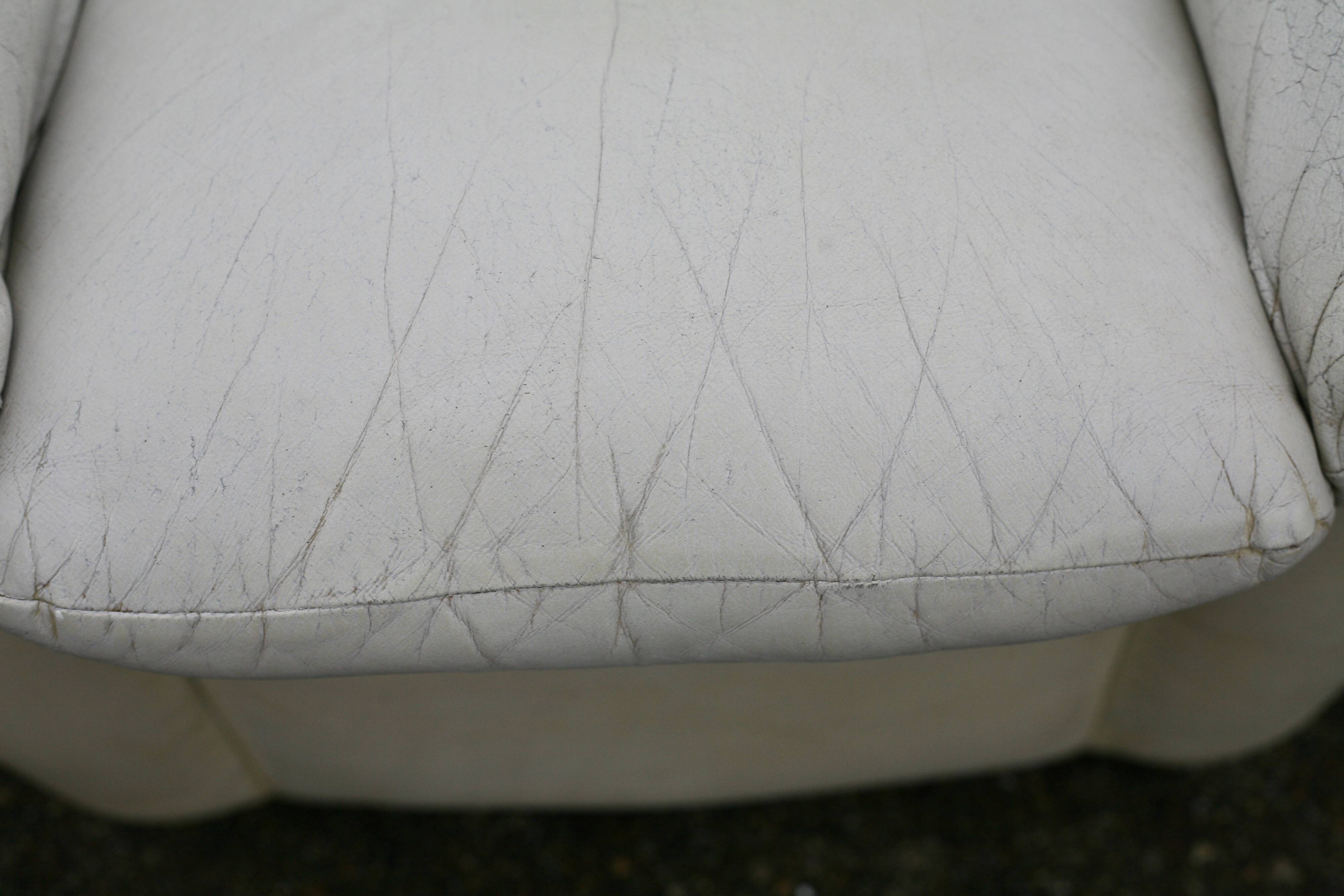 Pair of leather “space age” armchairs. Cream colour". Circa 1970.