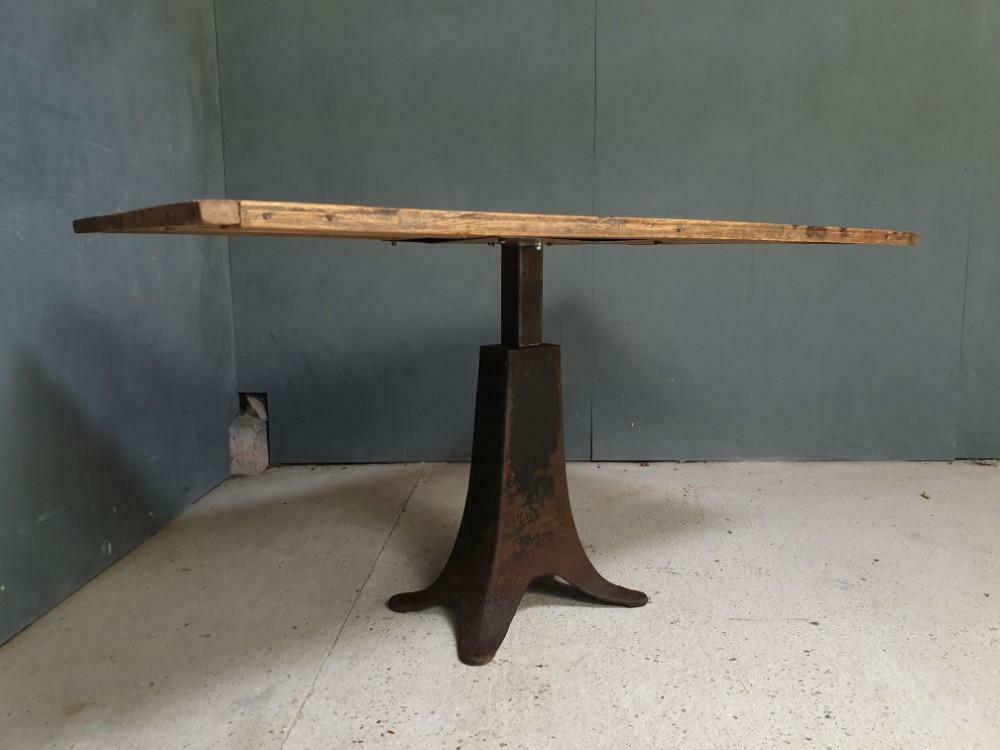 Old table on cast iron machine leg
