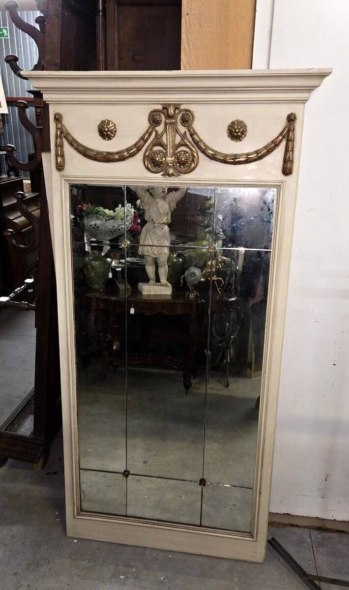 Louis XVI style trumeau mirror with a painted wooden frame.