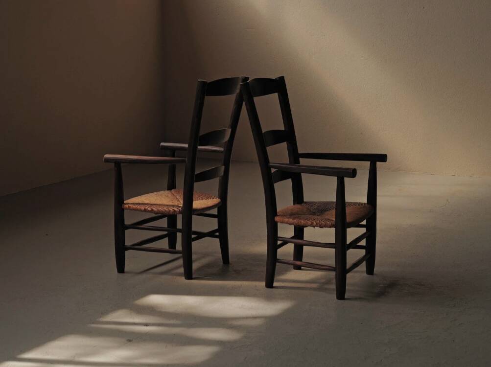 Pair of solid wood and straw armchairs, France, circa 1950.