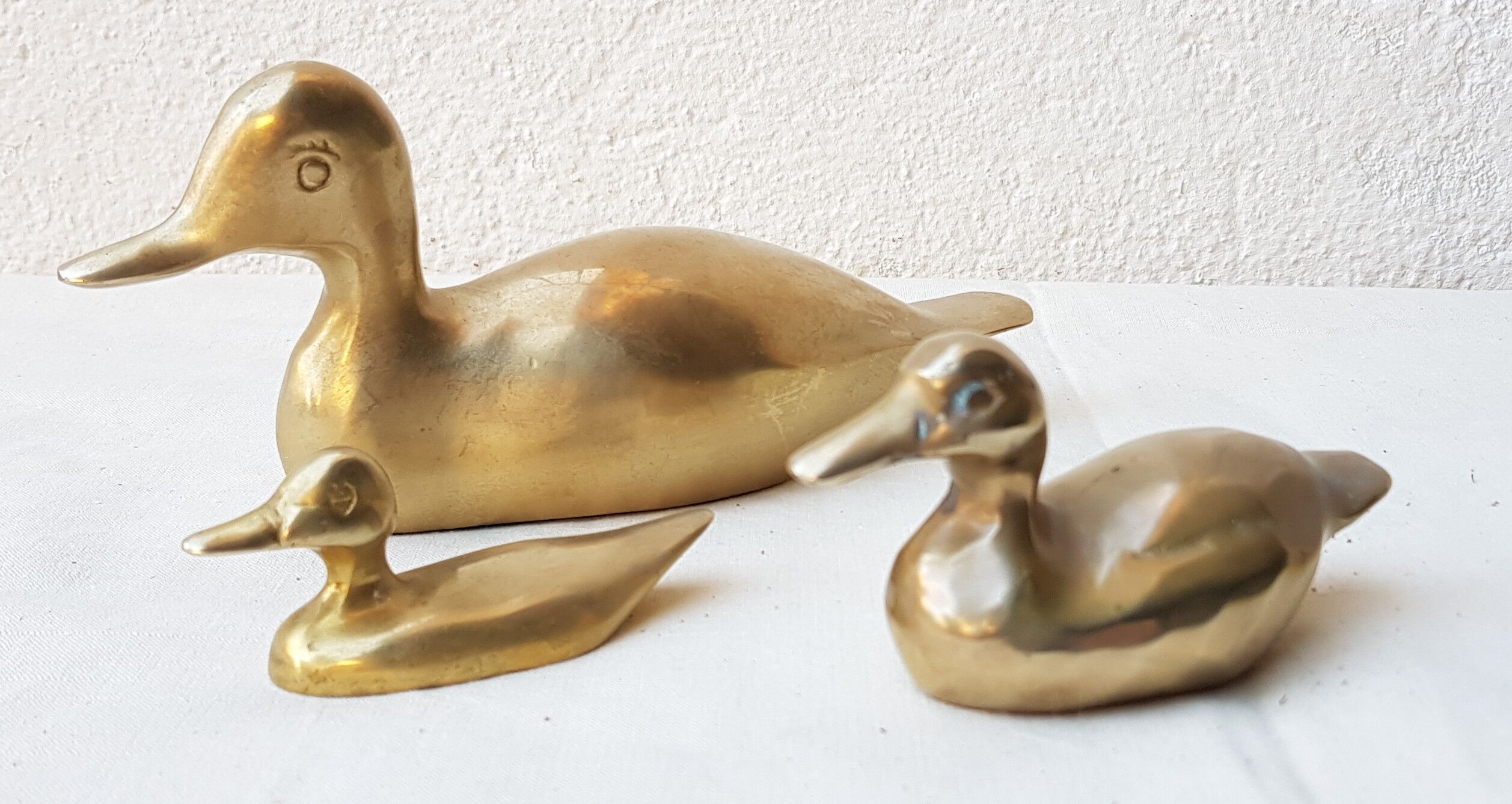 Trio of brass ducks