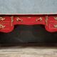 Louis XV style curved center desk in red lacquer and gilded bronze