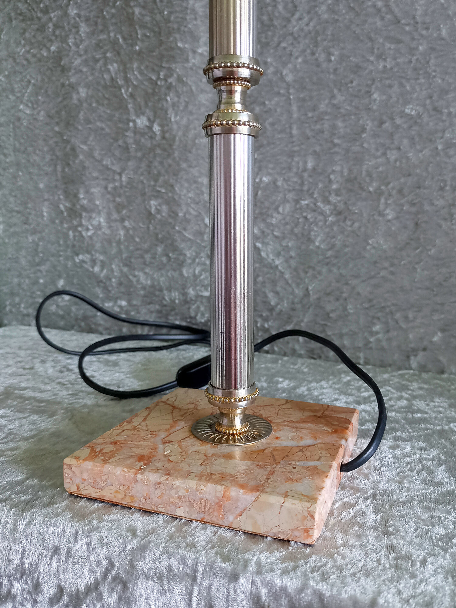 Golden metal lamp with pink marble base