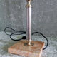 Golden metal lamp with pink marble base