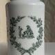 A pair of white glass bottles with Italian green patterns.
