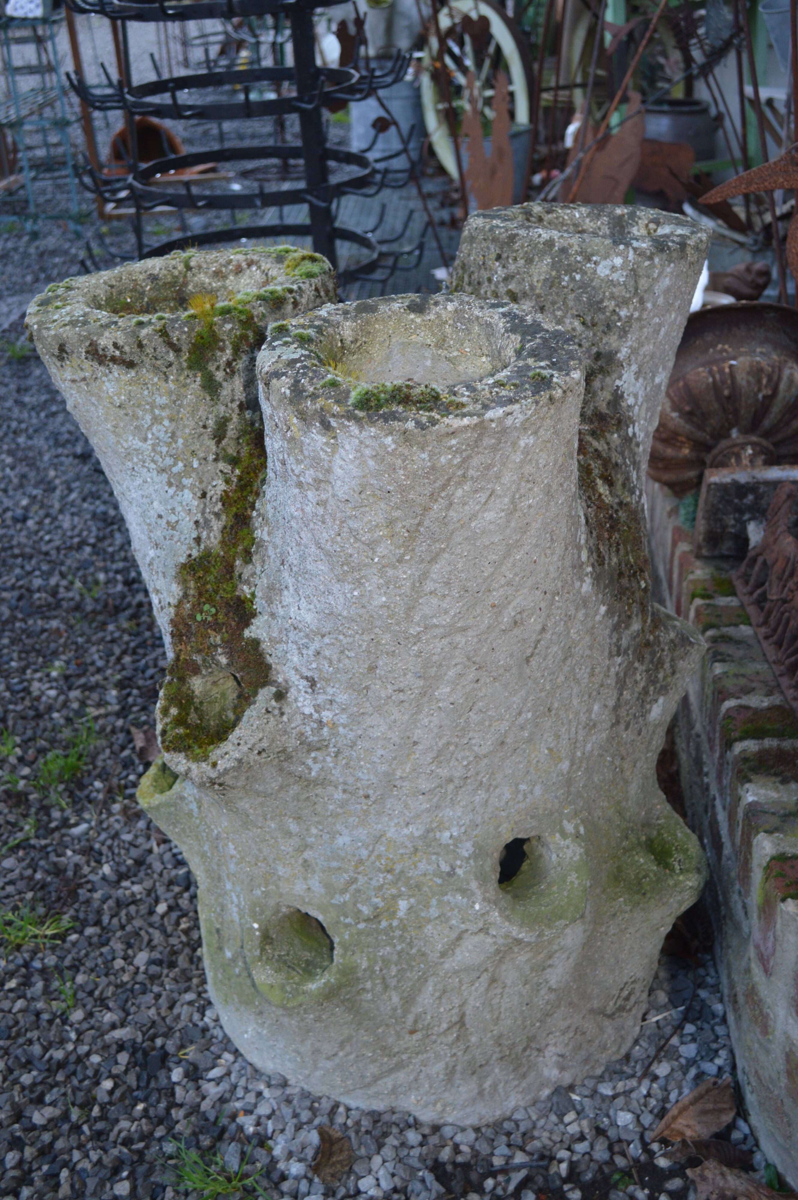 Concrete tree trunk planter