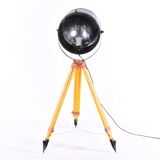 Old industrial spot on wooden tripod