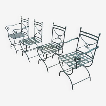 Two armchairs and two wrought iron garden chairs 20th