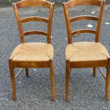 2 solid wood and straw dining chairs