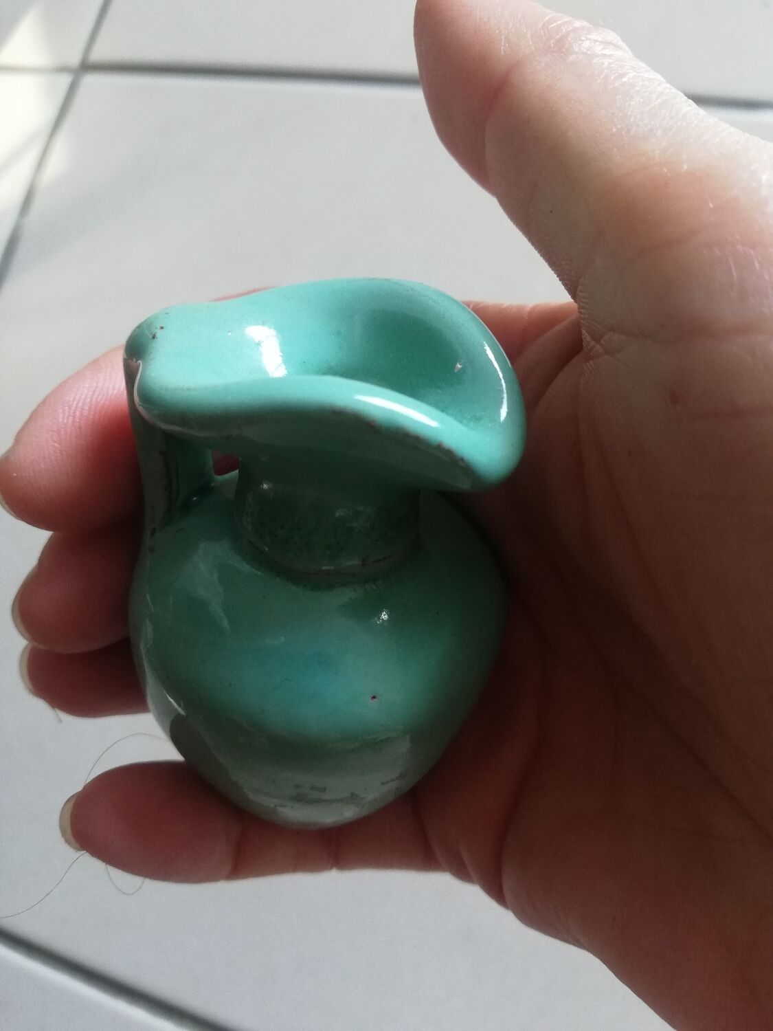 Very small turquoise soliflore in the shape of a ceramic jug