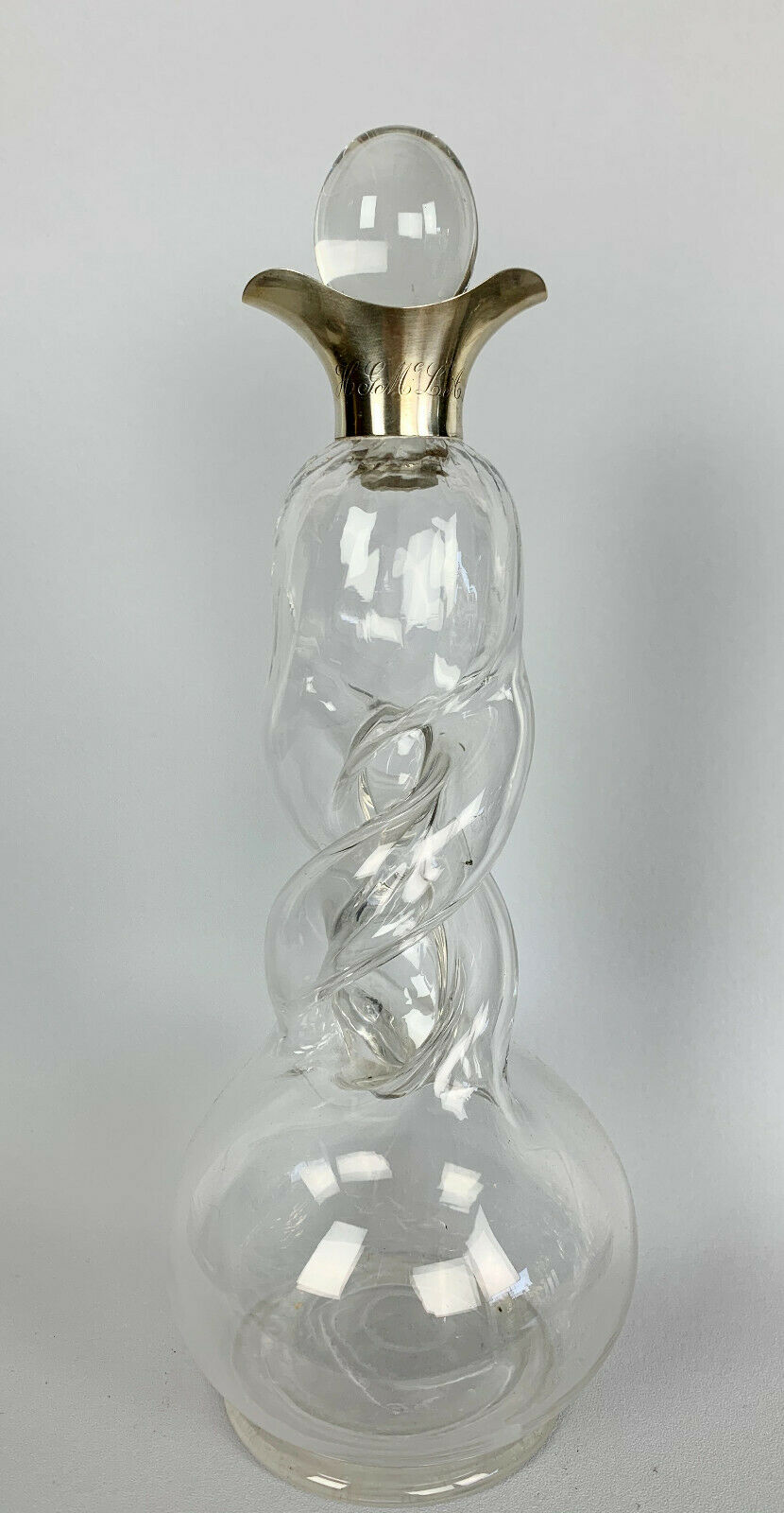 Blown glass carafe with silver frame