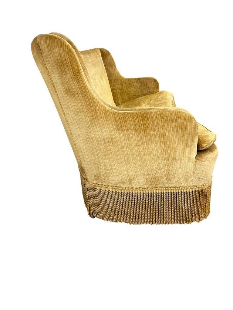 Vintage mustard yellow two-seater sofa with fringe