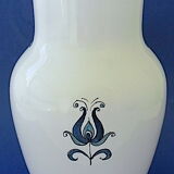 White-blue earthenware vase with stylized plant decoration
