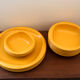 Service of vintage orange plastic plates 70s
