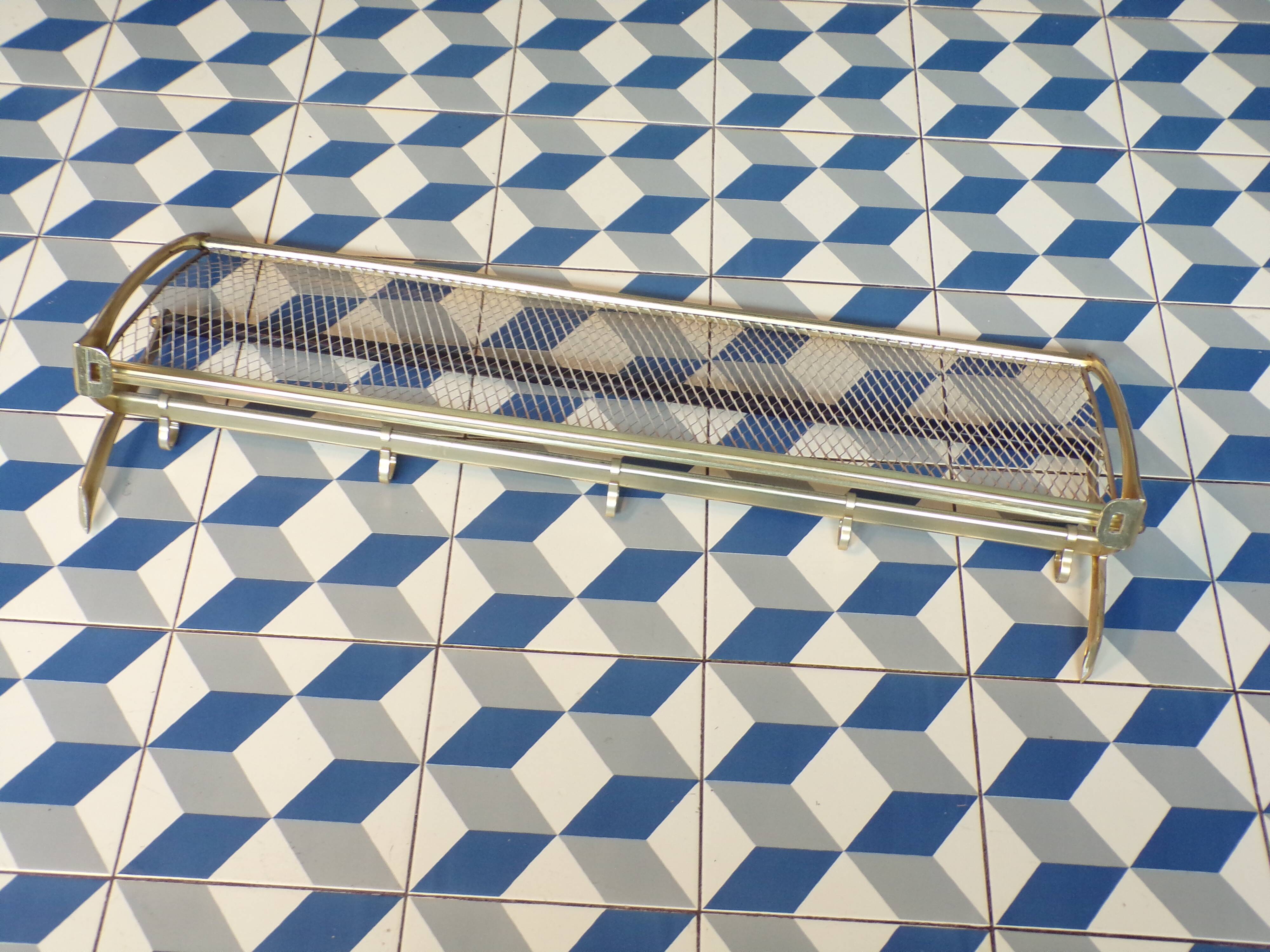 Vintage coat rack in the style of a train luggage rack.