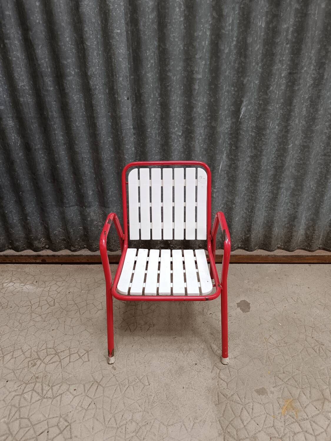 Red metal children's garden armchair