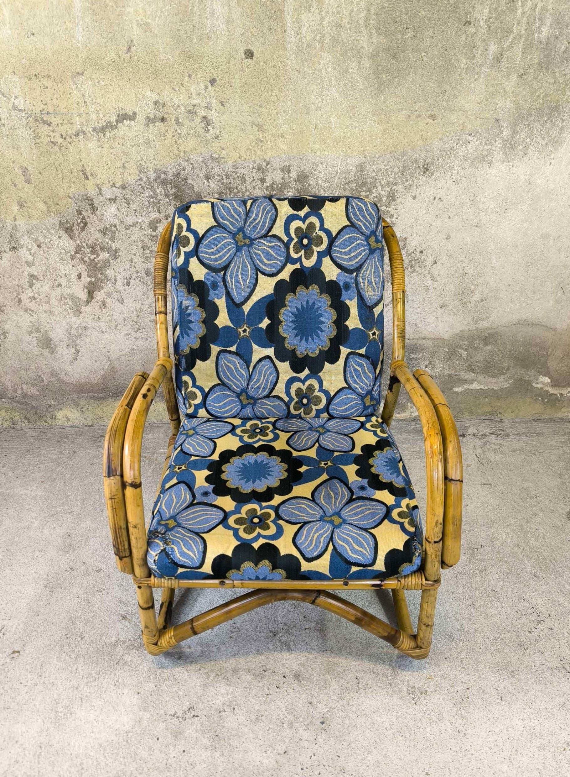 Vintage armchair in rattan and floral fabric