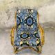 Fauteuil vintage en rotin et tissu à fleurs