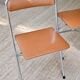 Pair of “Soudexvinyl” folding chairs in skai and chrome tube