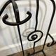 Wall-mounted coat rack in wrought iron, early 20th century