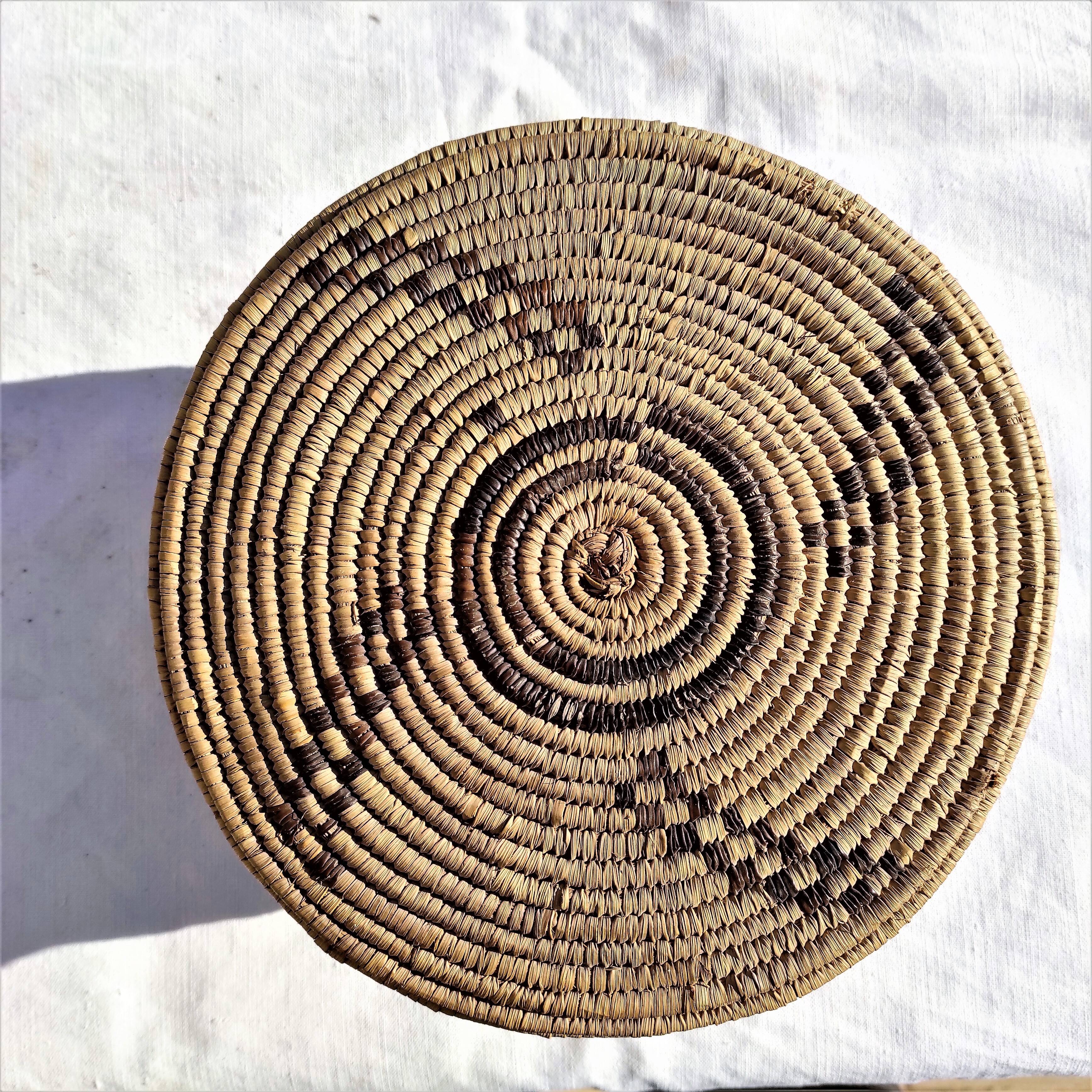 Antique basket with ethnic lid with black/brown and red décor